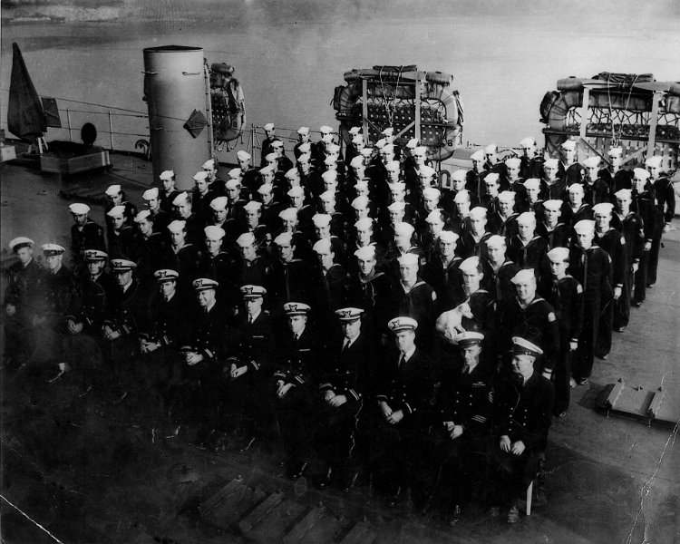 Before Deployment to Pacific.jpg - LST 884 Plank OwnersShipmate Armand Dugas believes this photo was taken at the Dravo Ship Yard shortly after first boarding. Notice the K9 mascot, lower right hand of photo. (Karl Krumm family photos)